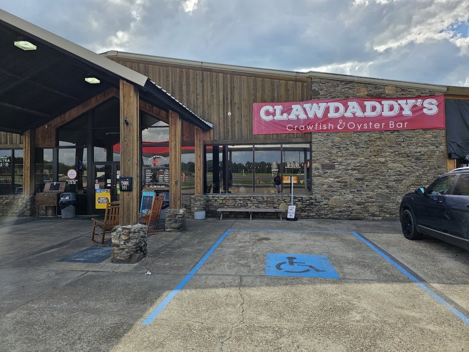 Seafood restaurant exterior with patio seating.